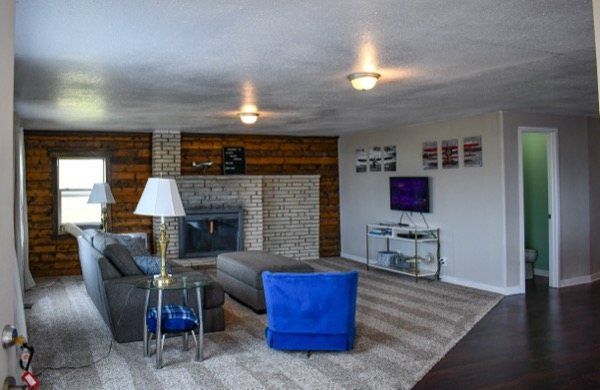 Living room with a stone fireplace