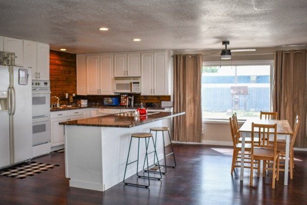 Kitchen with island seating and wood accents