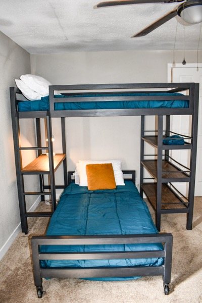 Twin bunk beds beside the window