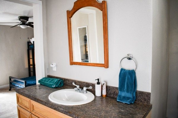 Bathroom vanity with an arched mirror